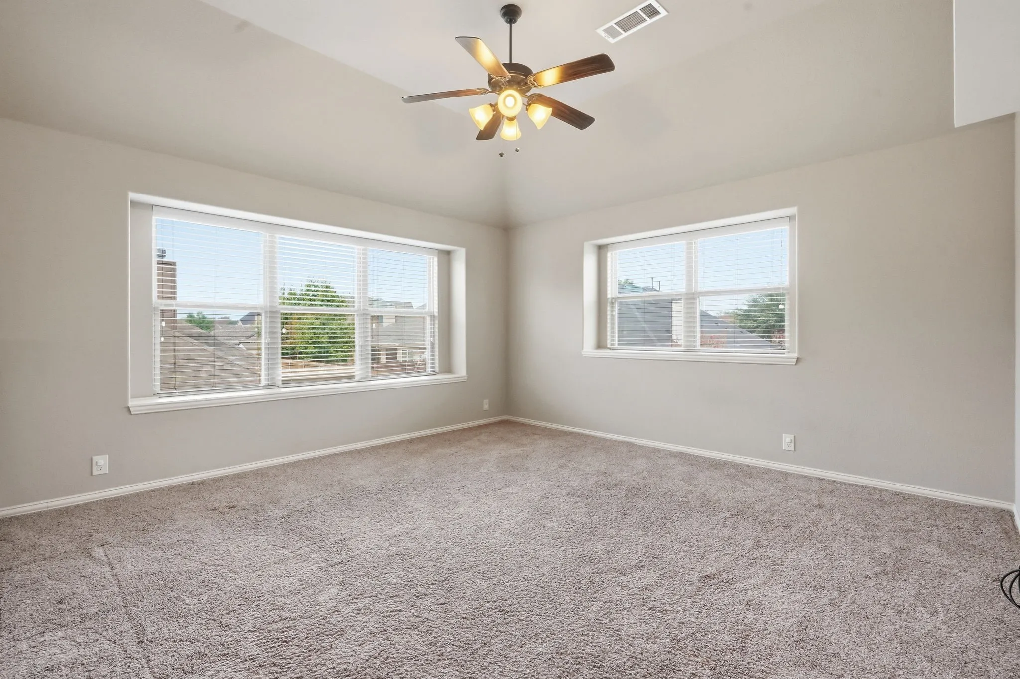 Dual windows with blinds and window seating