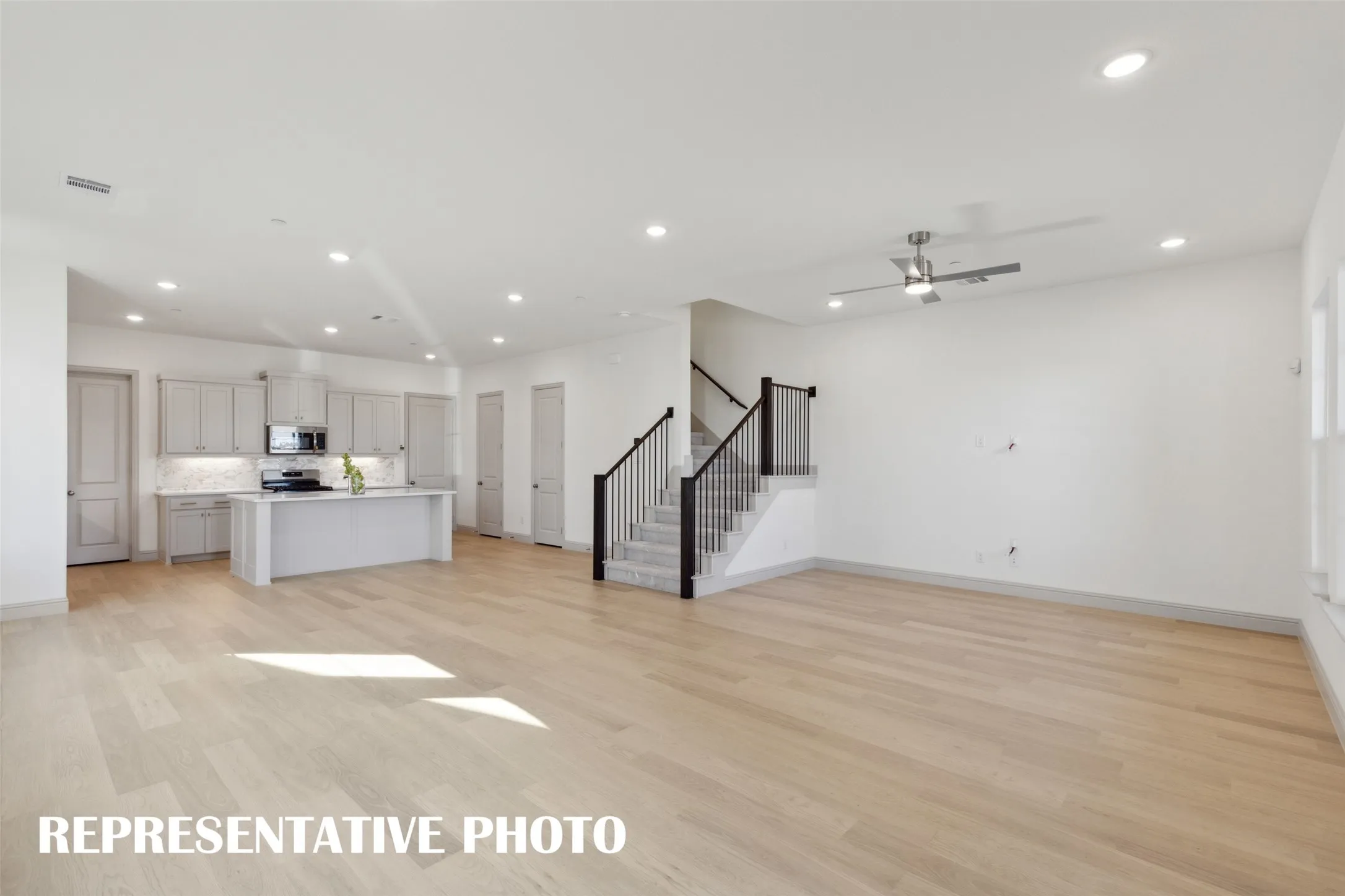 Our Wyatt floor plan offers an open concept design that is perfect for entertaining a crowd or enjoying cozy family get togethers!  REPRESENTATIVE PHOTO