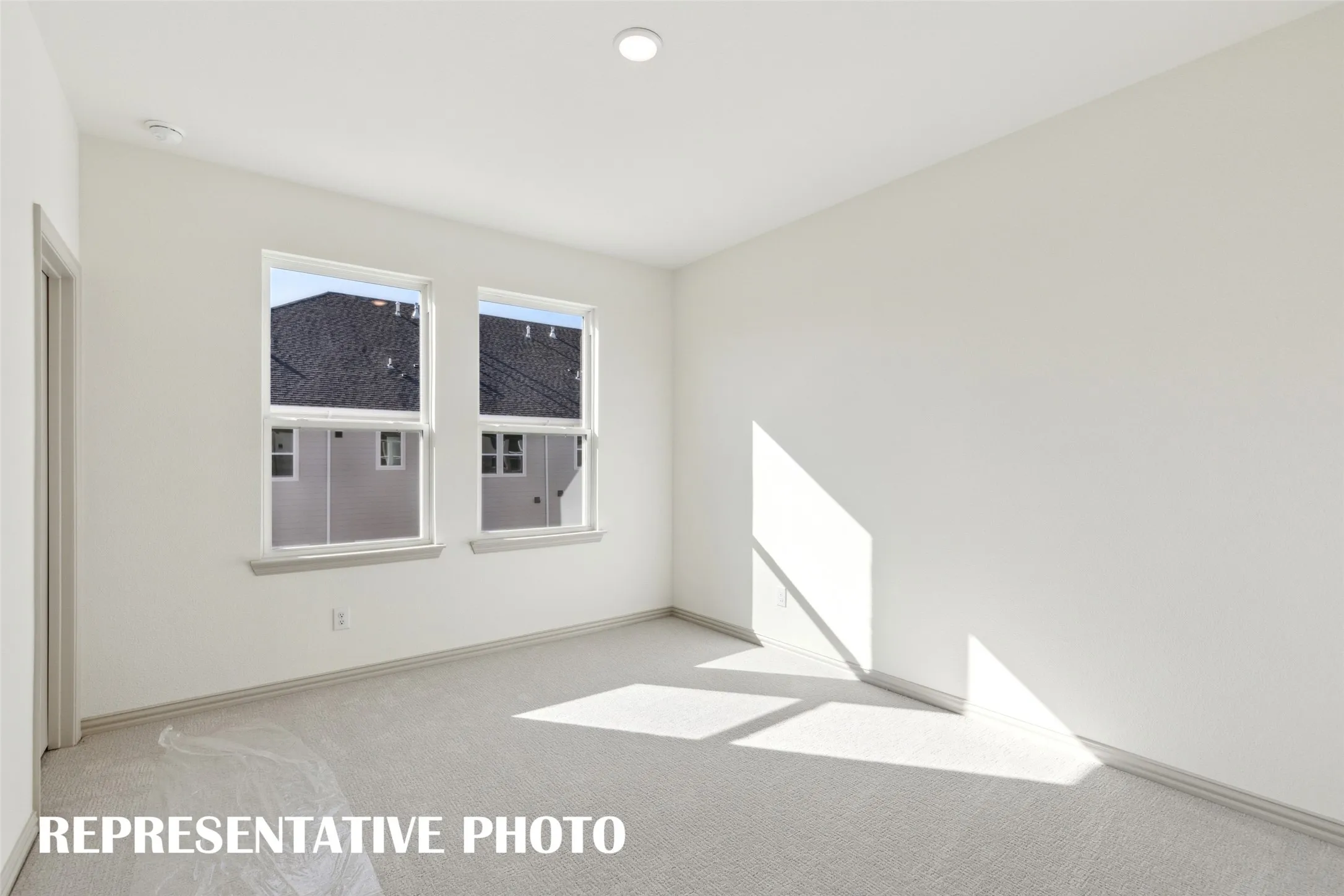 One of two nicely sized secondary bedrooms offered in our Wyatt floor plan.  REPRESENTATIVE PHOTO