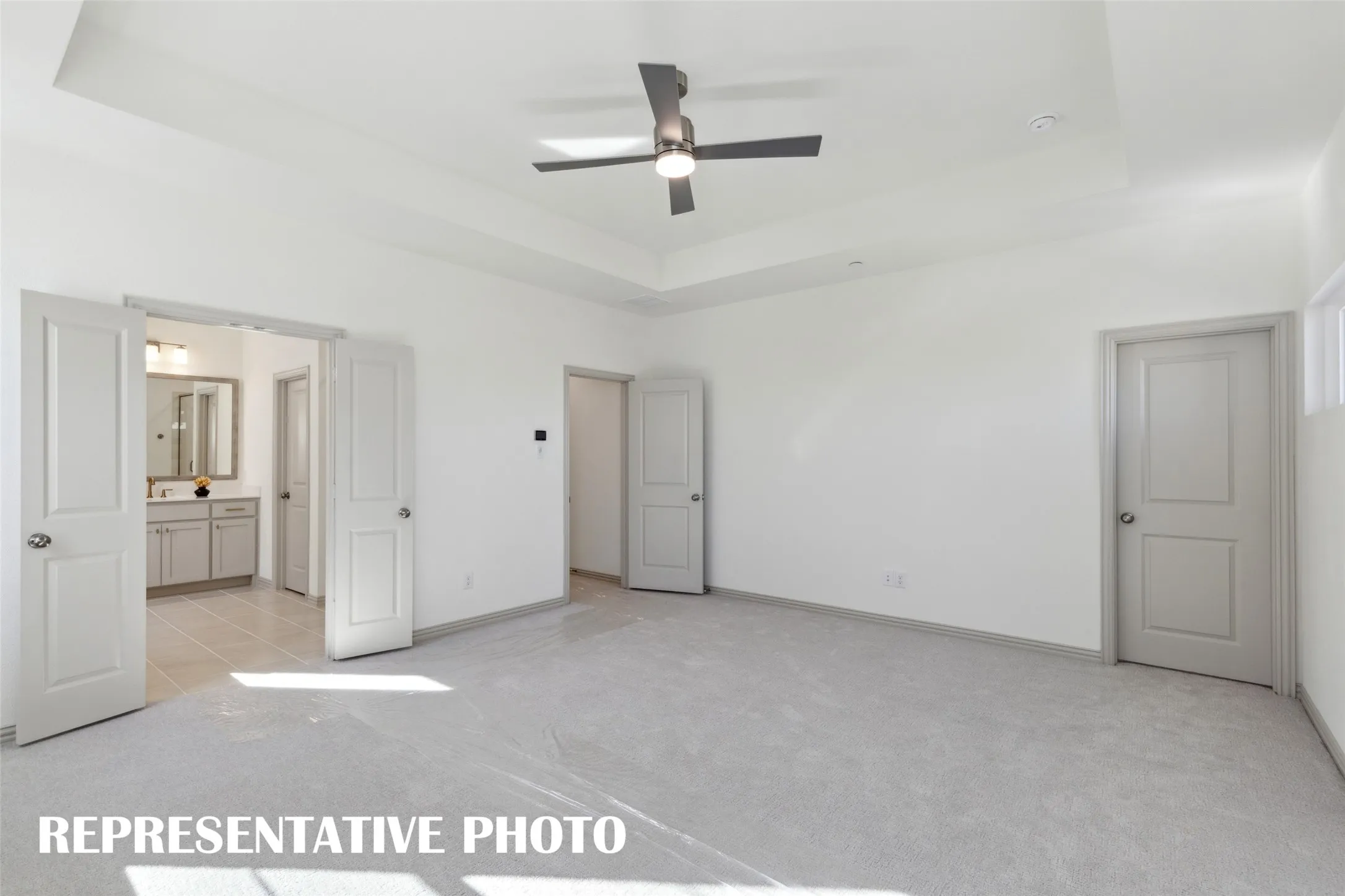 Offering two, spacious walk in closets and a gorgeous en suite bath, this owner's suite was designed with you in mind!  REPRESENTATIVE PHOTO