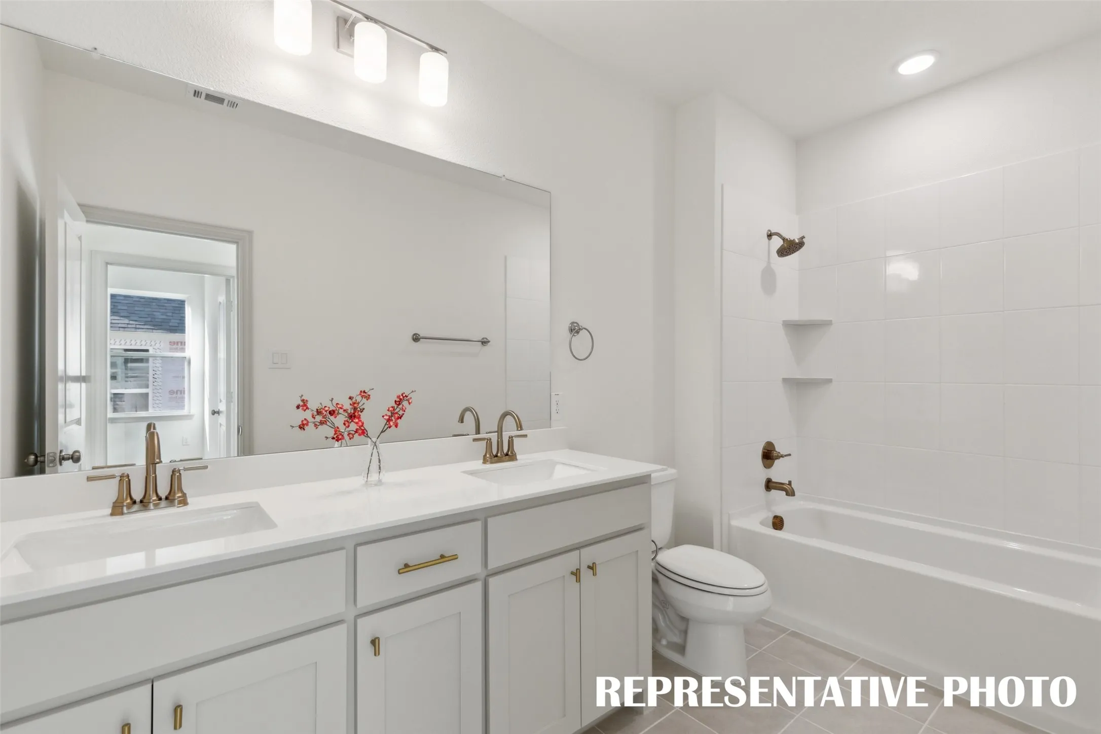 Friends and family will enjoy this thoughtfully designed guest bath offering space for two.  REPRESENTATIVE PHOTO