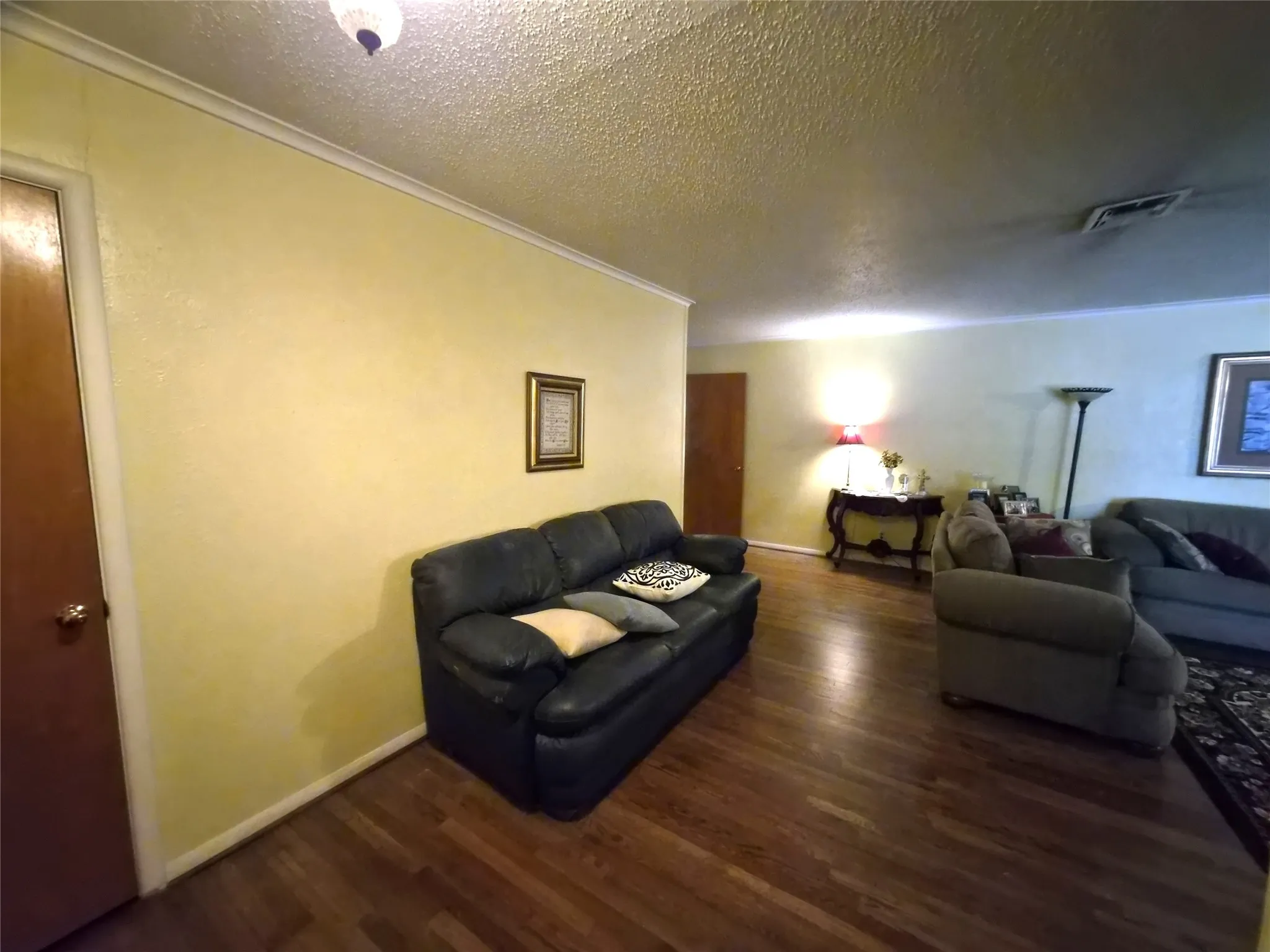 Formal living area with original hardwood floors.