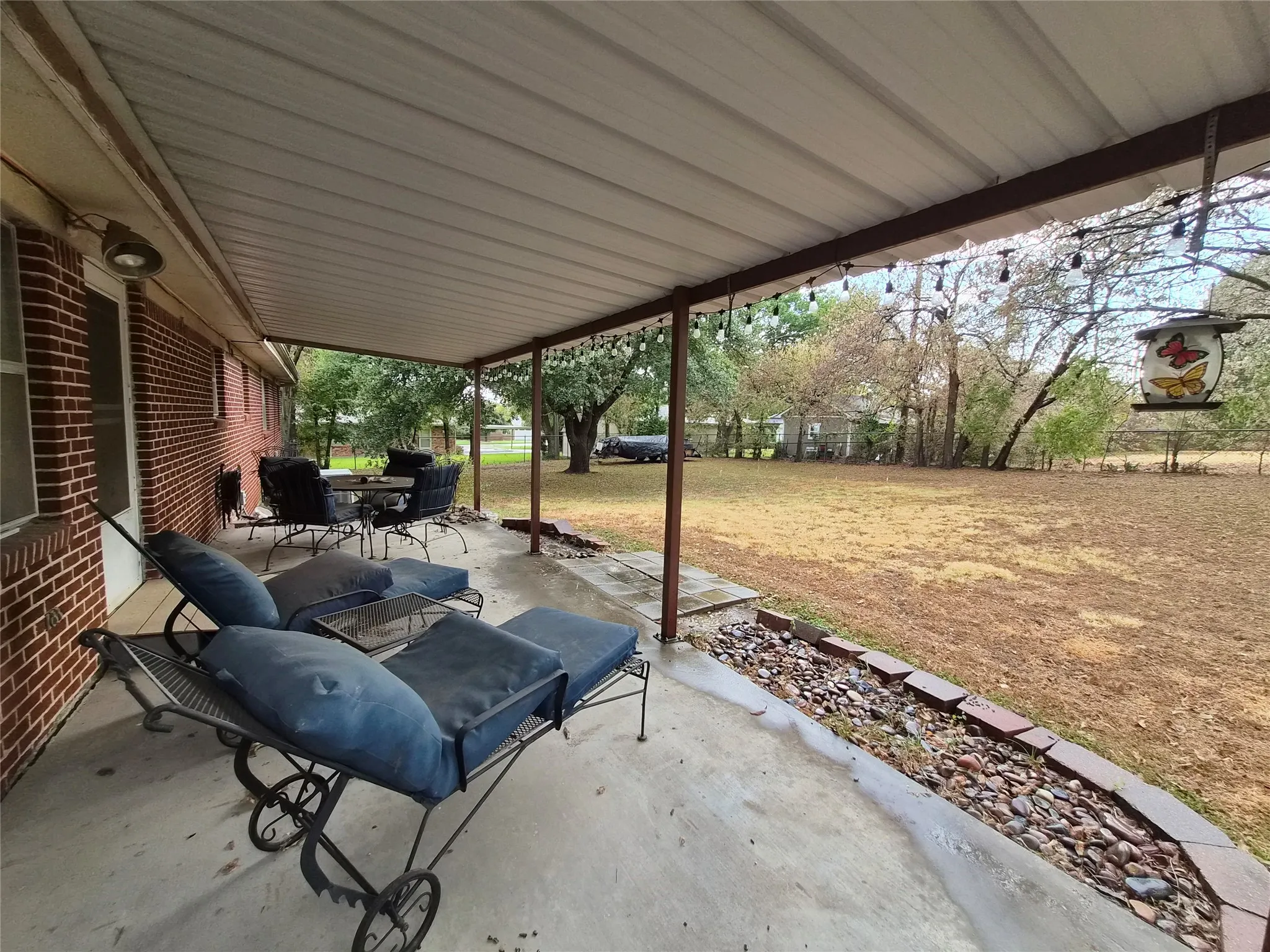 Long covered patio with plenty of room for entertaining.