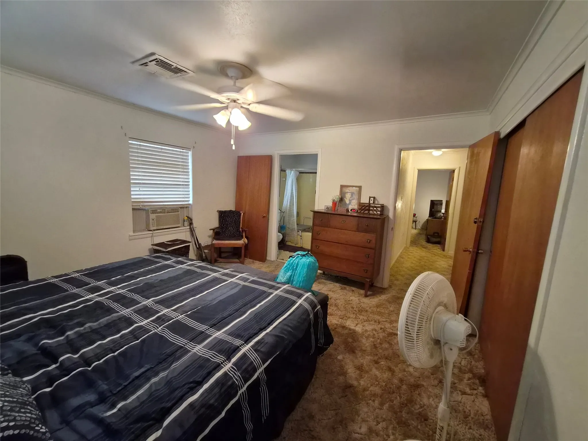 Primary bedroom with large walk in closet and attached bath.