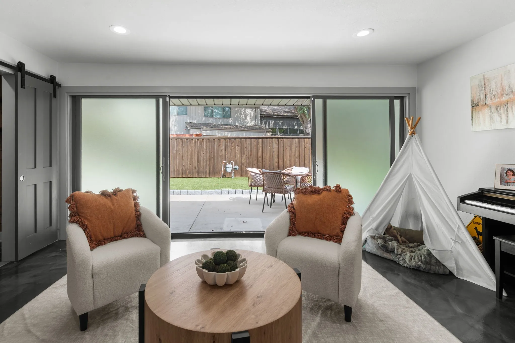 Sitting area off the living room that opens up to the back patio.