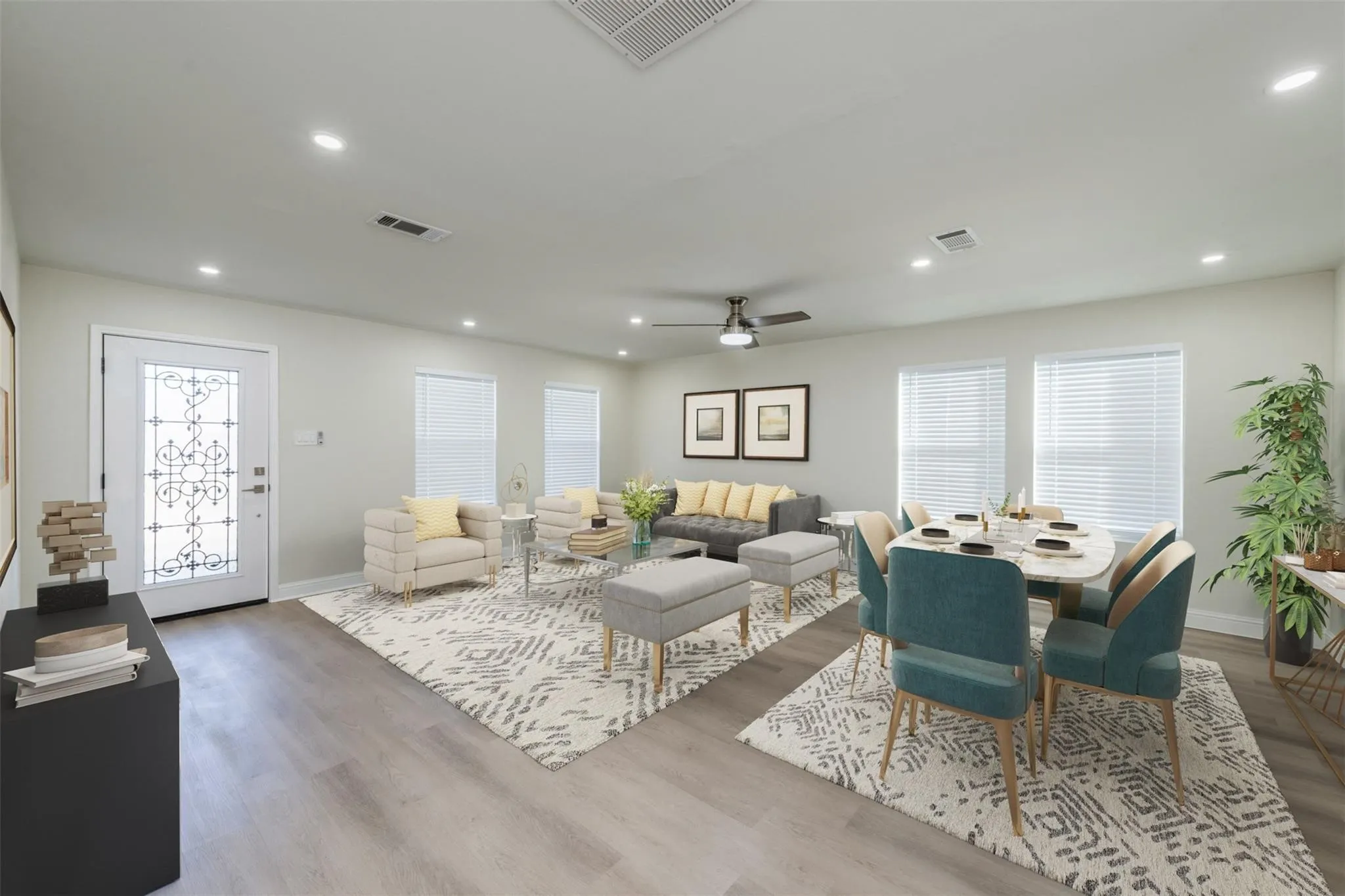 Living room with ceiling fan and hardwood / wood-style flooring