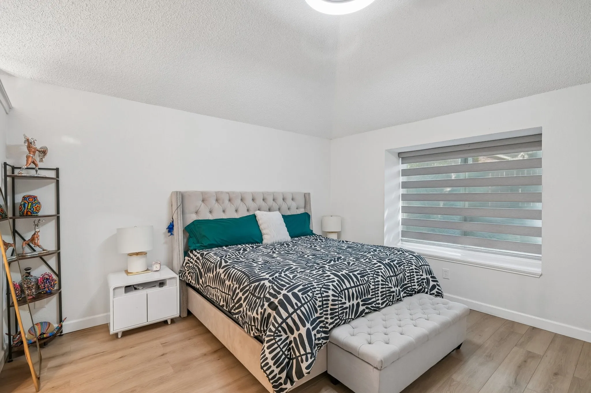 Primary bedroom with custom window shades