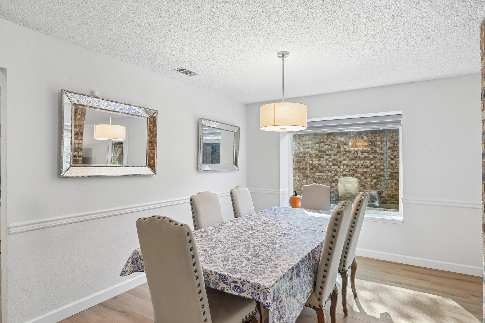 Gorgeous picture window looking out to the side yard patio