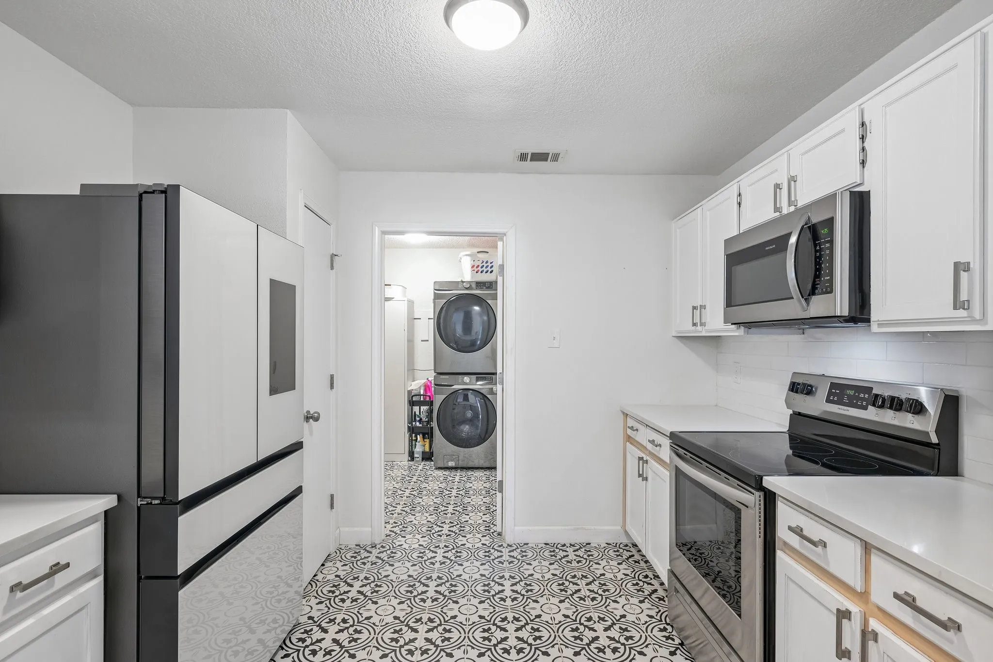 Updated kitchen with decorative tile floors
