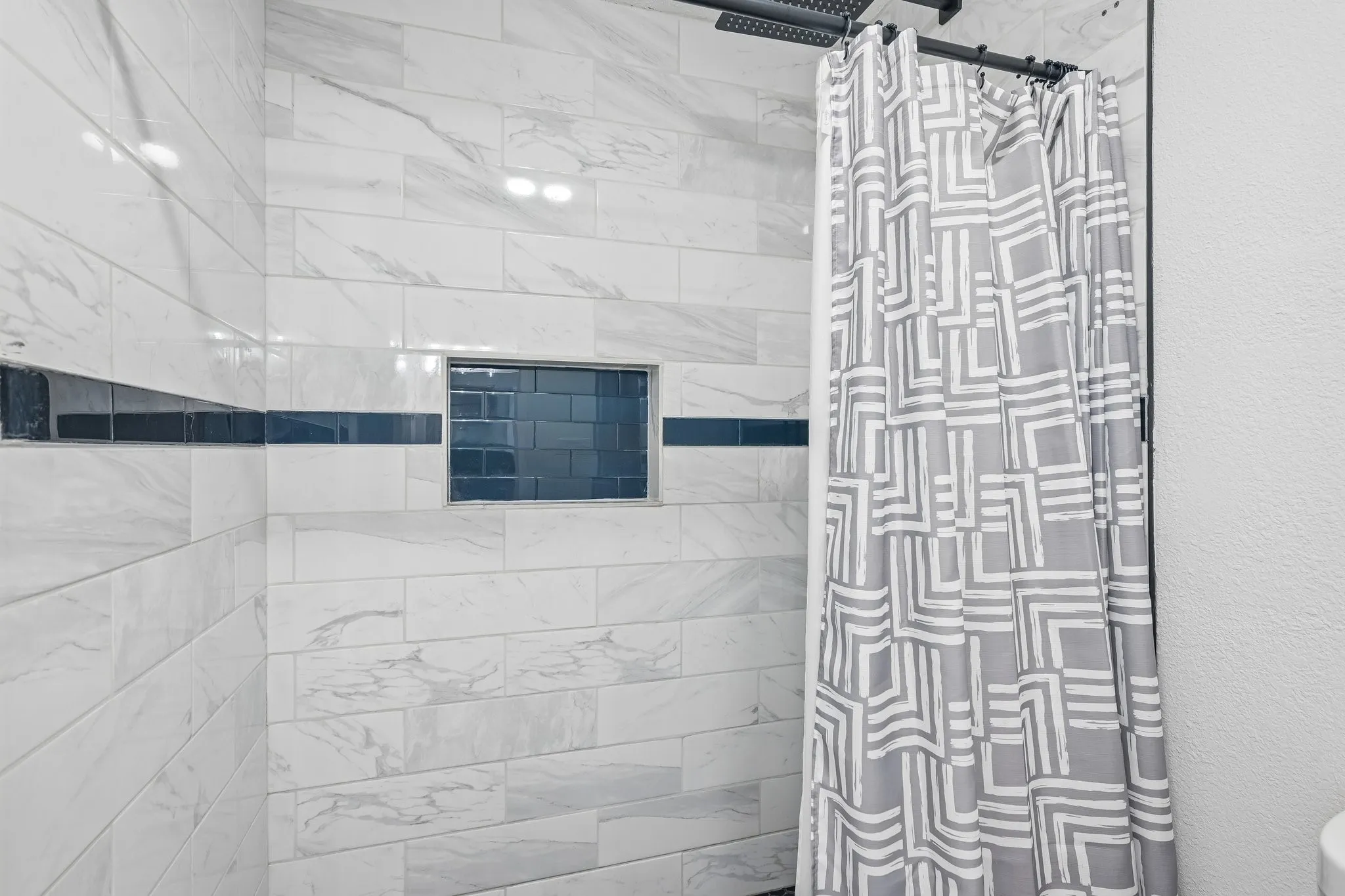 Updated walk-in shower in primary bath