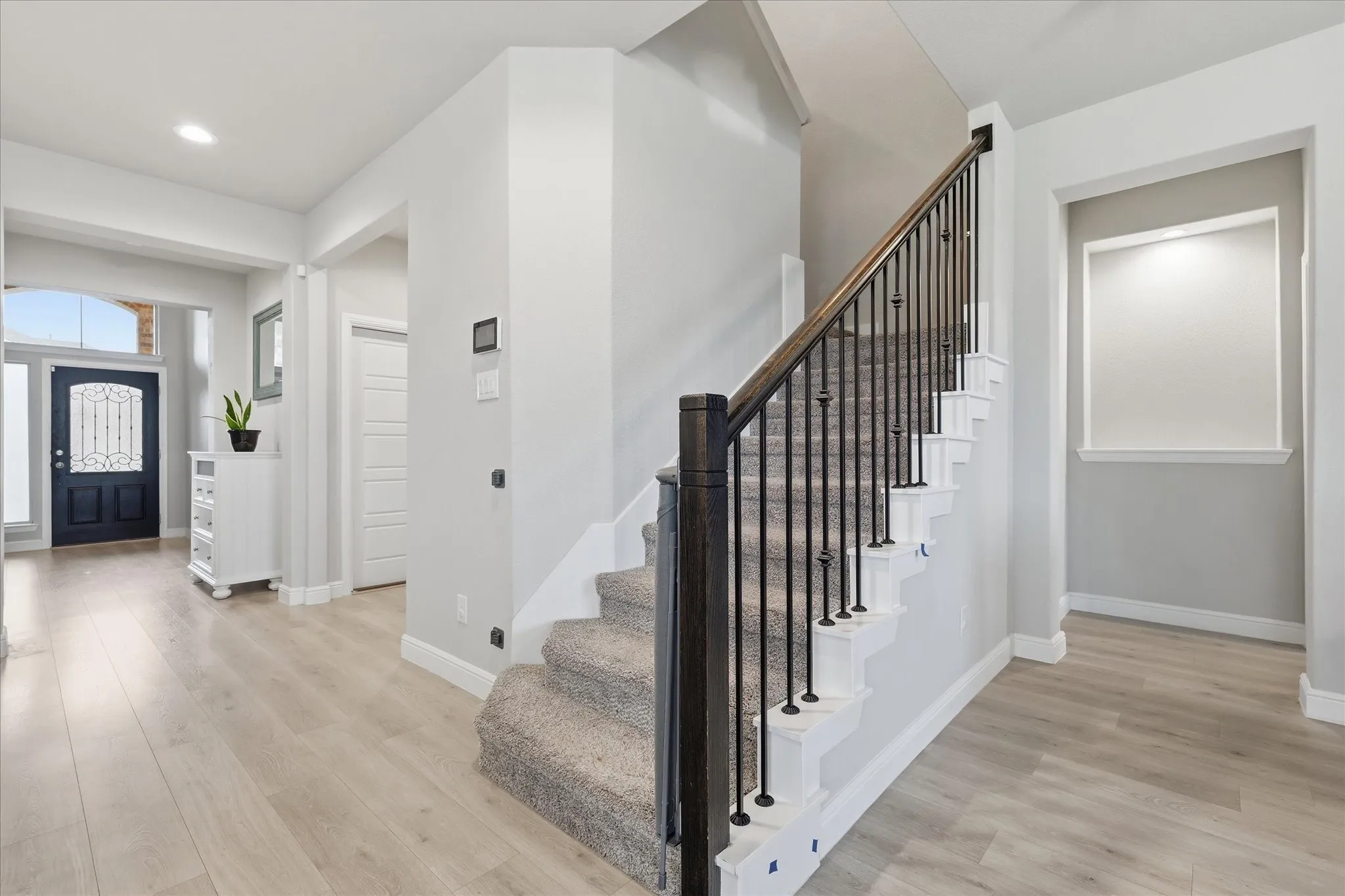 Stairs with view toward entry