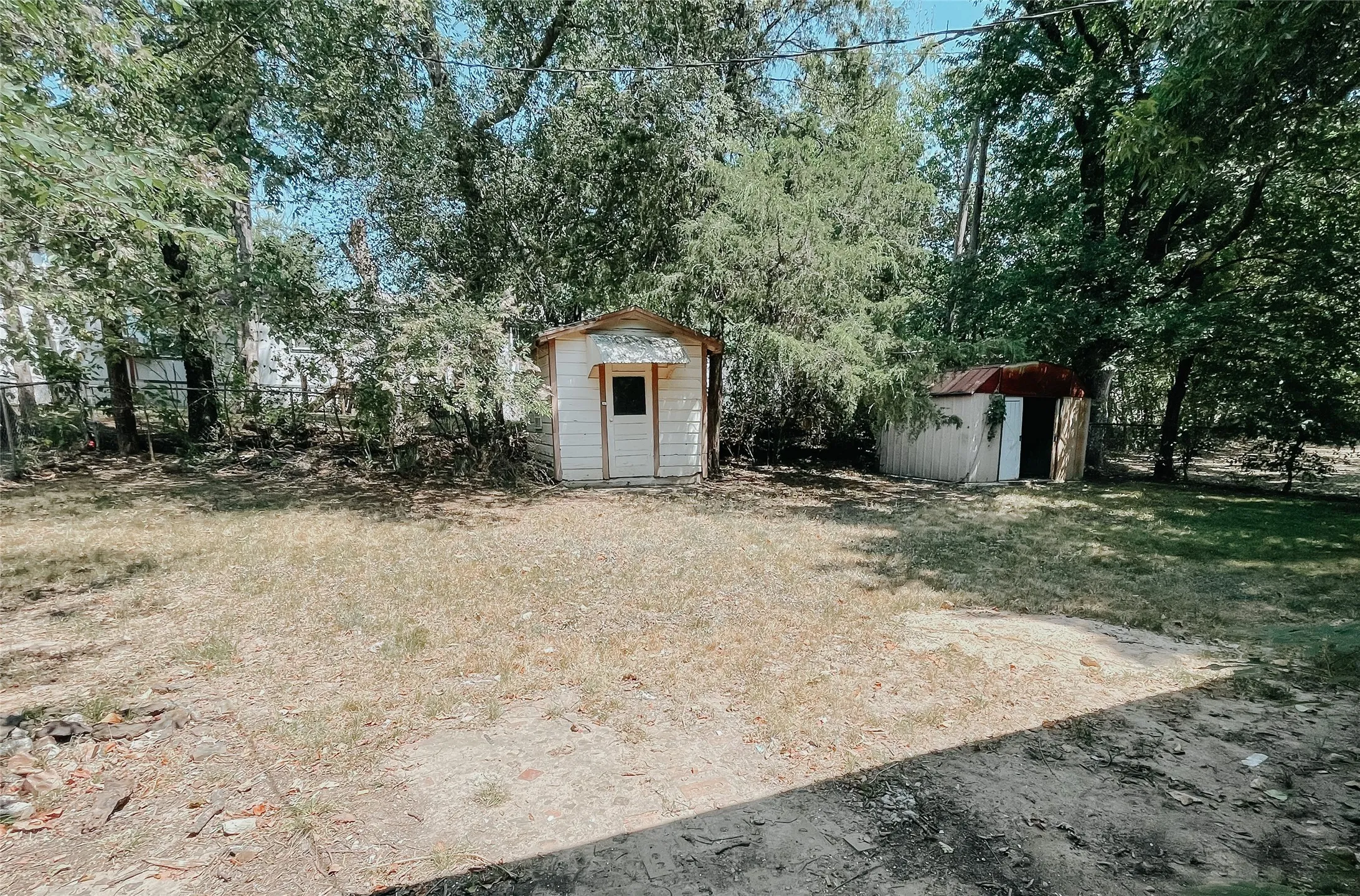 View of yard featuring a storage unit