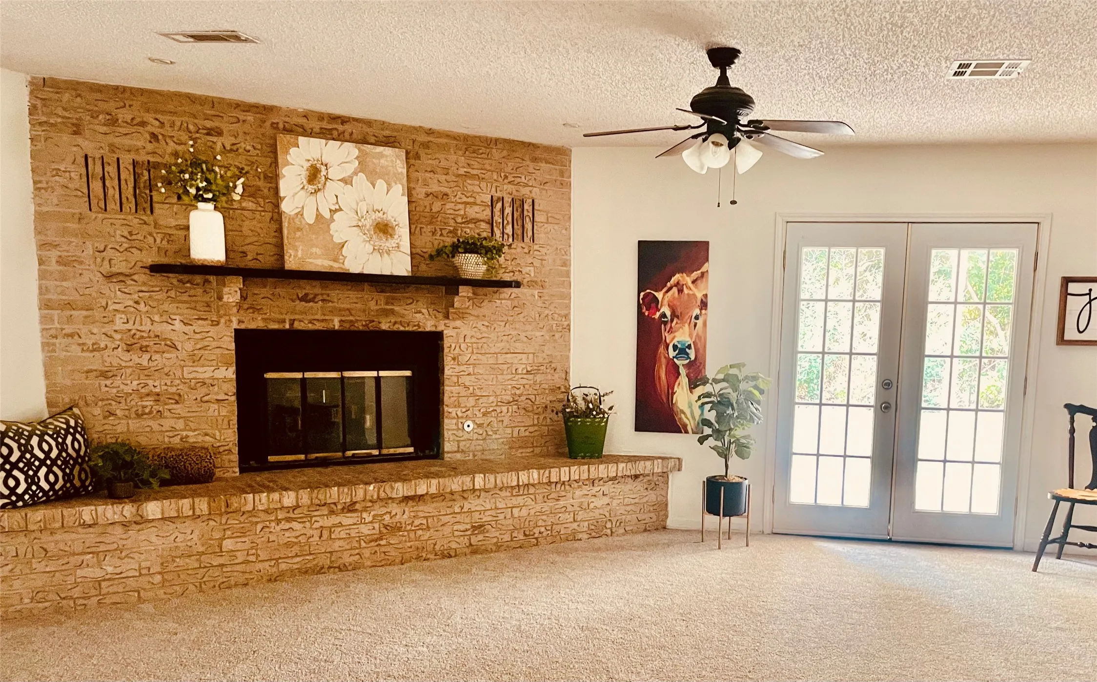 Double French doors open to covered patio
