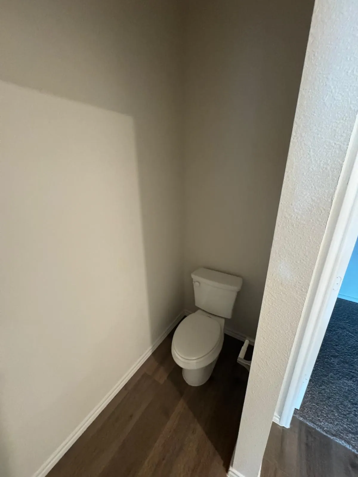 Bathroom with baseboards and dark wood finished floors