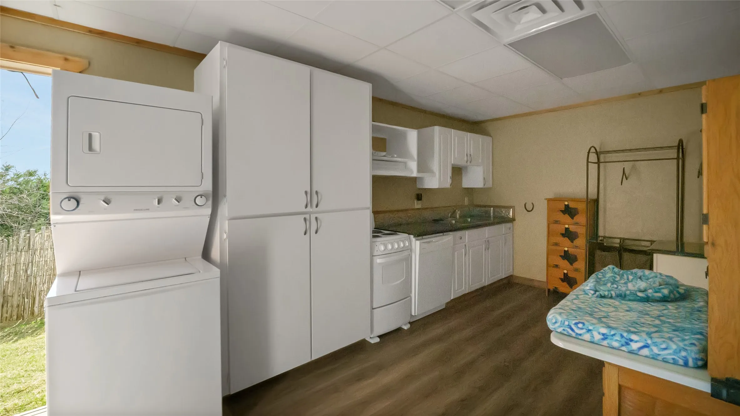 Bldg. 1 common kitchen space, backdoor, storage and stackable washer/dryer