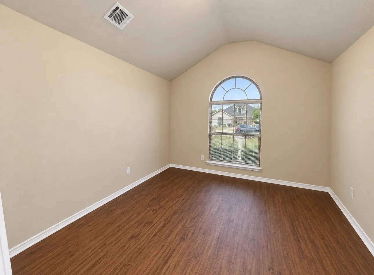Vaulted ceiling with an arched window