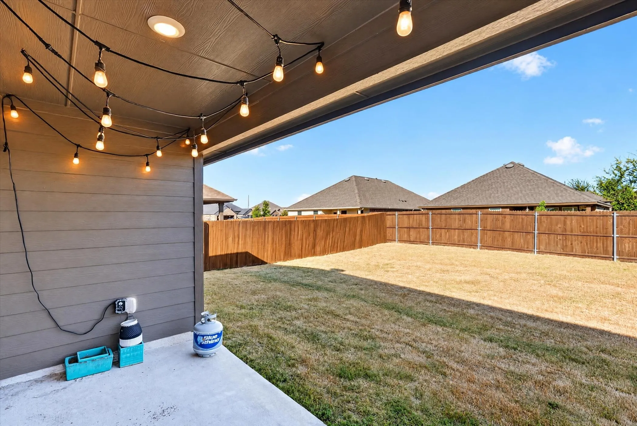 Covered patio with recessed lighting, string lights, and concrete flooring