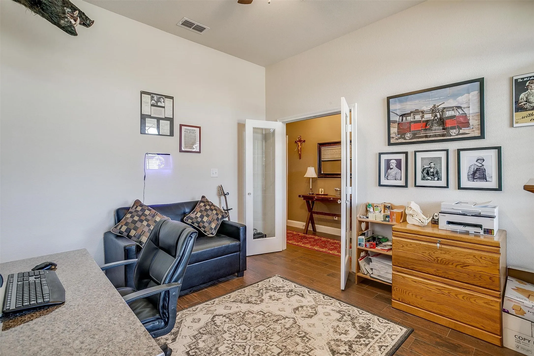 Vaulted ceiling, wood-finish flooring, white walls, double French doors, recessed lighting