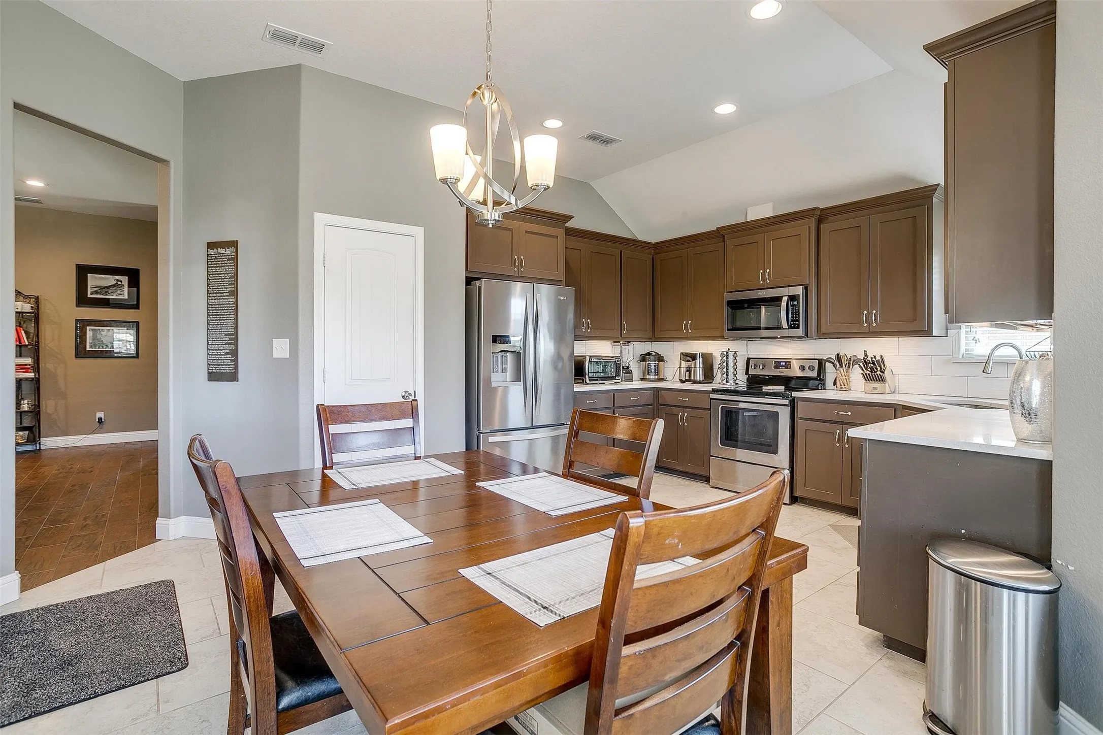 Kitchen featuring stainless steel appliances, white subway tile backsplash, white countertops, and recessed lighting
