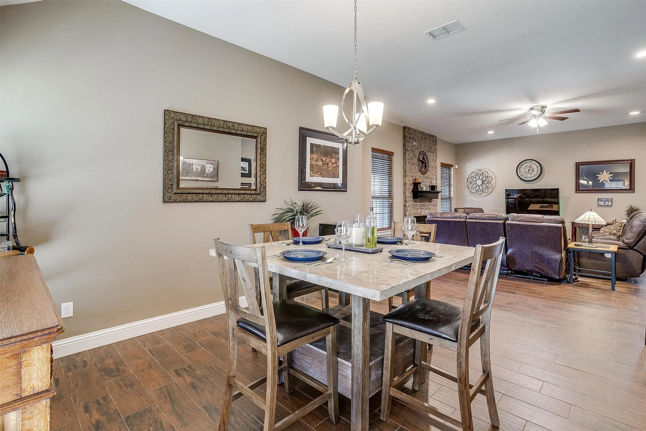 Wood-finish flooring throughout, complemented by neutral wall tones and recessed lighting