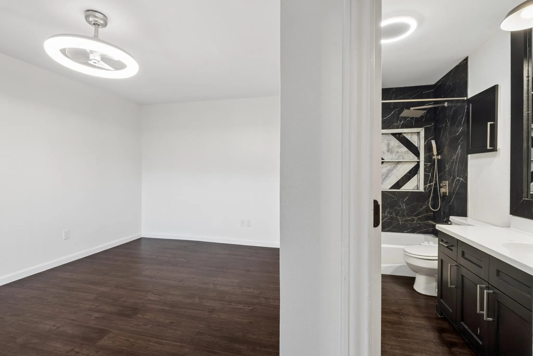 Wood-finish flooring with a modern ceiling fan