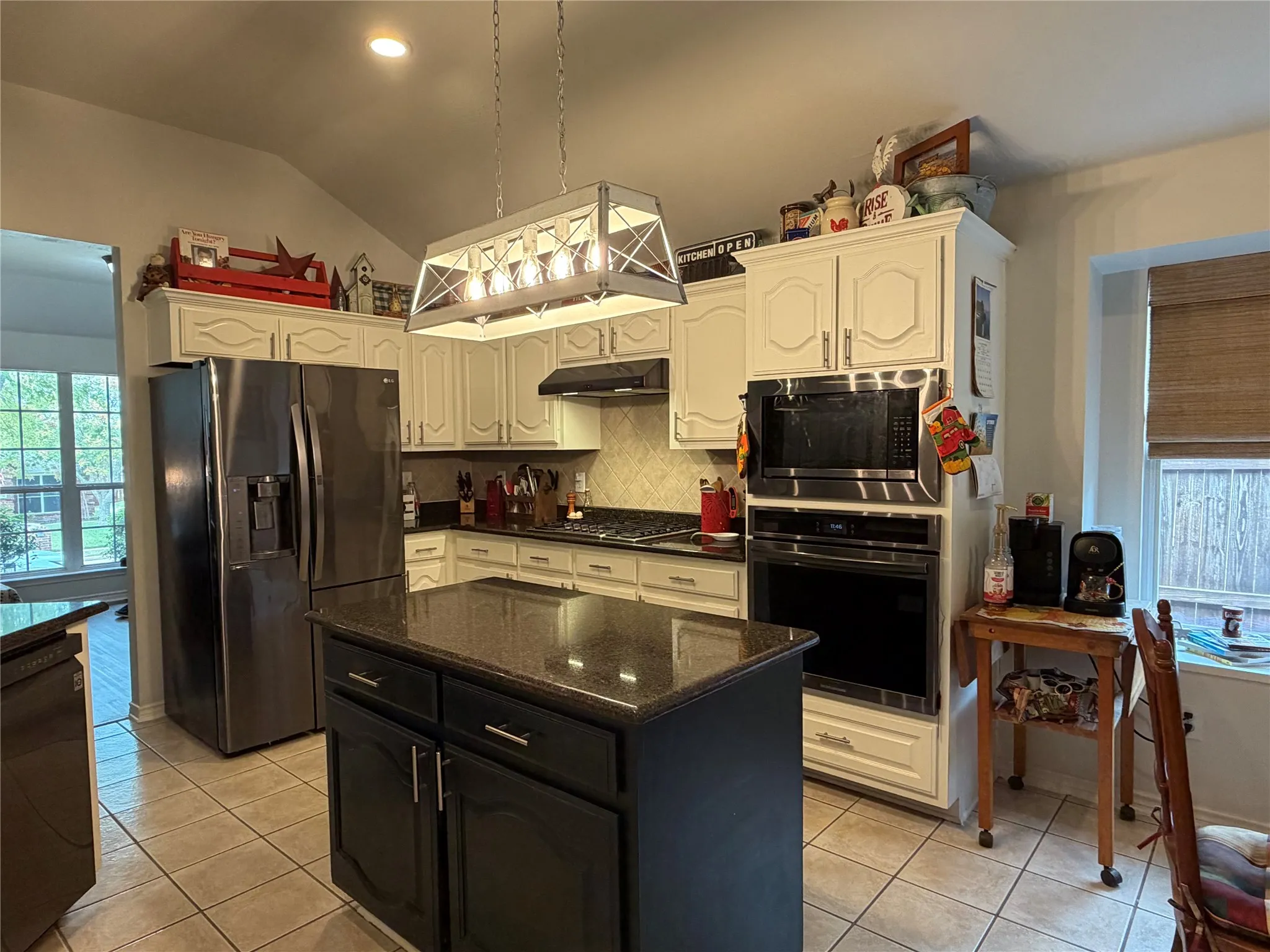 The Heart of the Home is a Delightful Kitchen Equipped with a Gas Cooktop, Beautiful Granite Countertops, a Big Walk-In Pantry