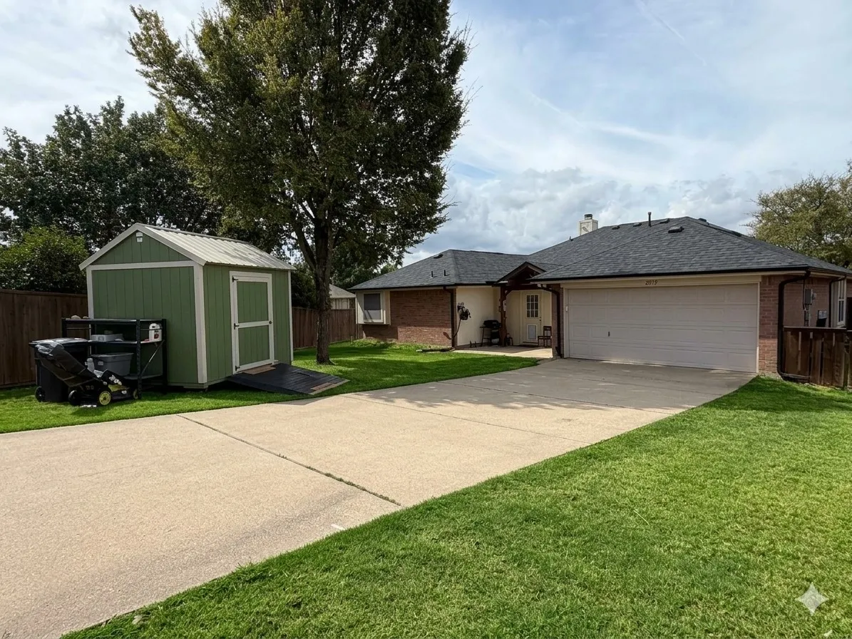 The Sprawling Backyard is Private and Securely Outfitted with an Automatic Gate, a Long Driveway, a Dog Run and a Convenient Storage Building. (Grass Color Digitally Enhanced)