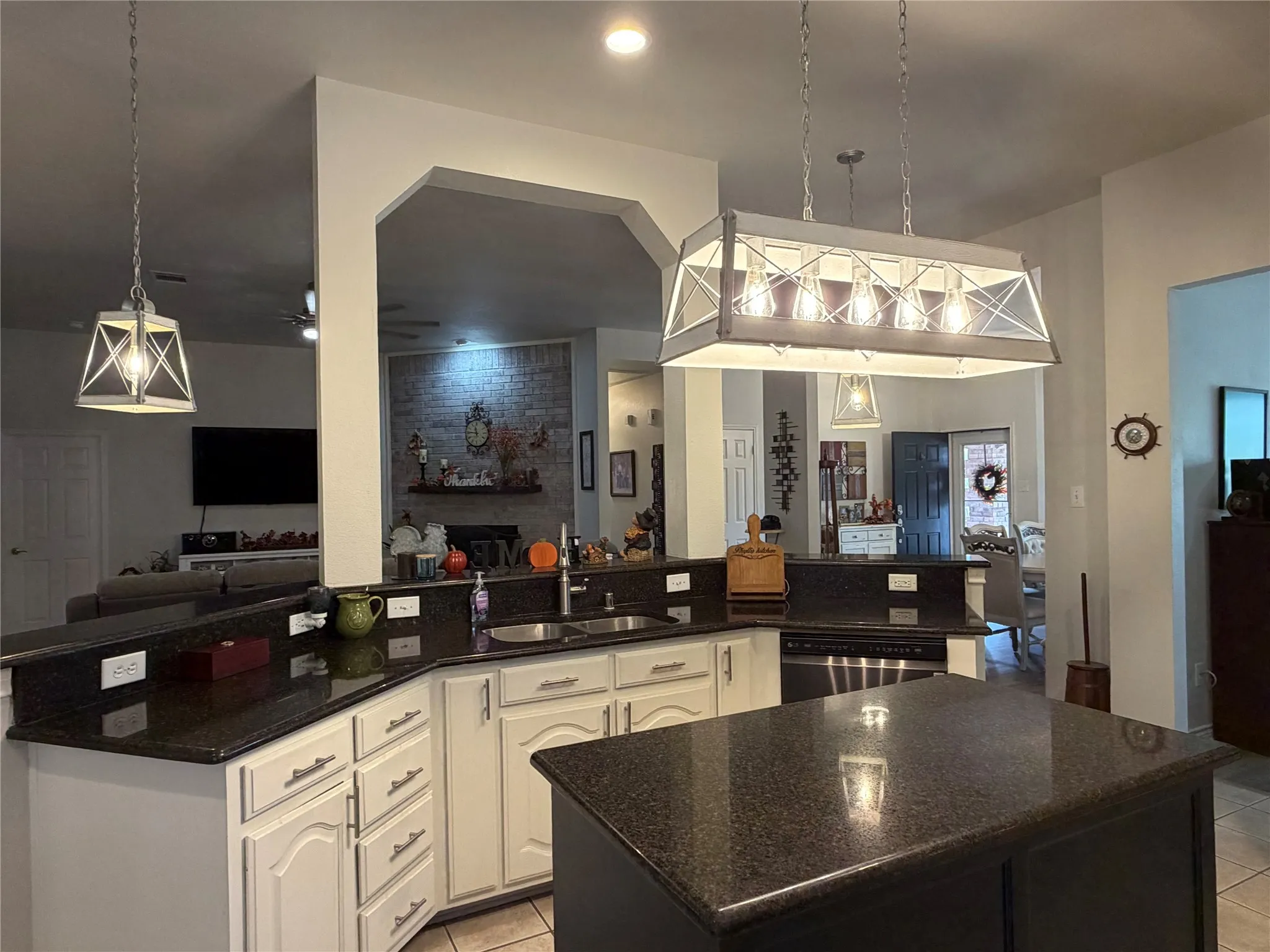 The Heart of the Home is a Delightful Kitchen Equipped with a Gas Cooktop, Beautiful Granite Countertops, a Big Walk-In Pantry