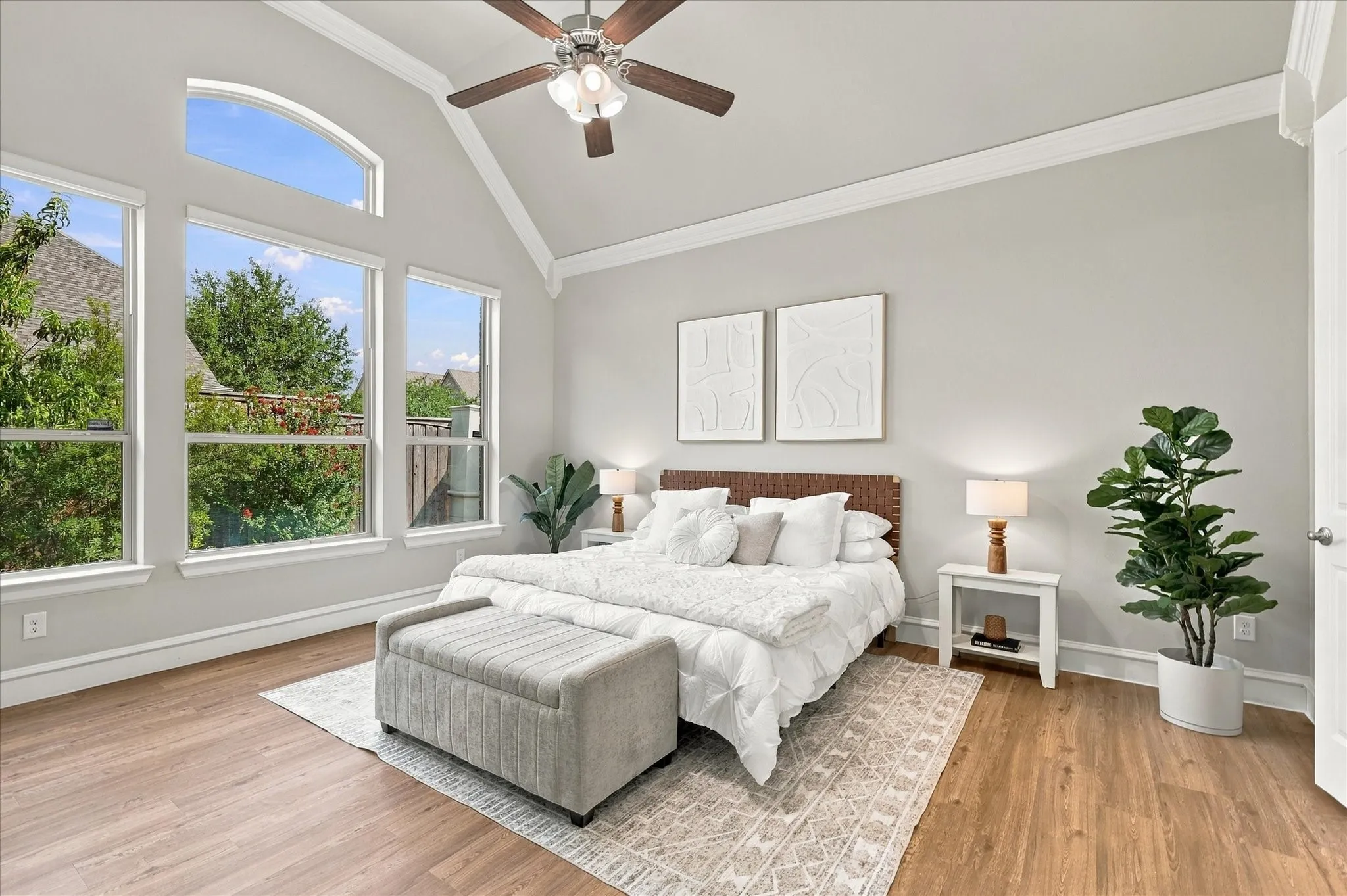 First floor primary suite with backyard views