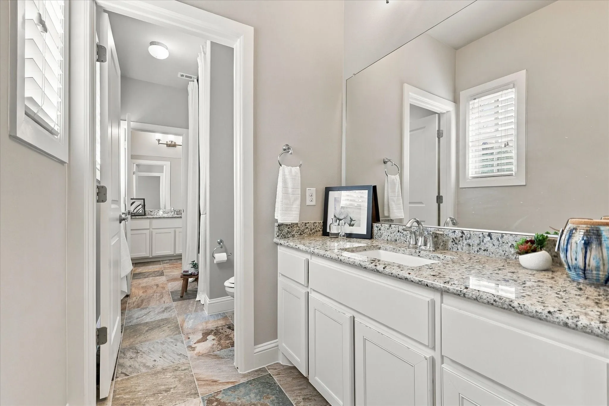 Jack and Jill bathroom with granite counters