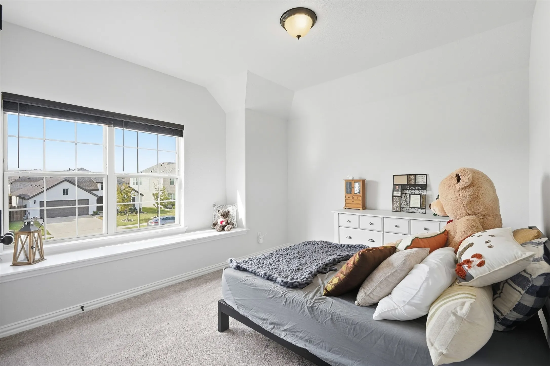 Recessed window with a spacious window seat, grid-pattern windows, and a flush mount ceiling light