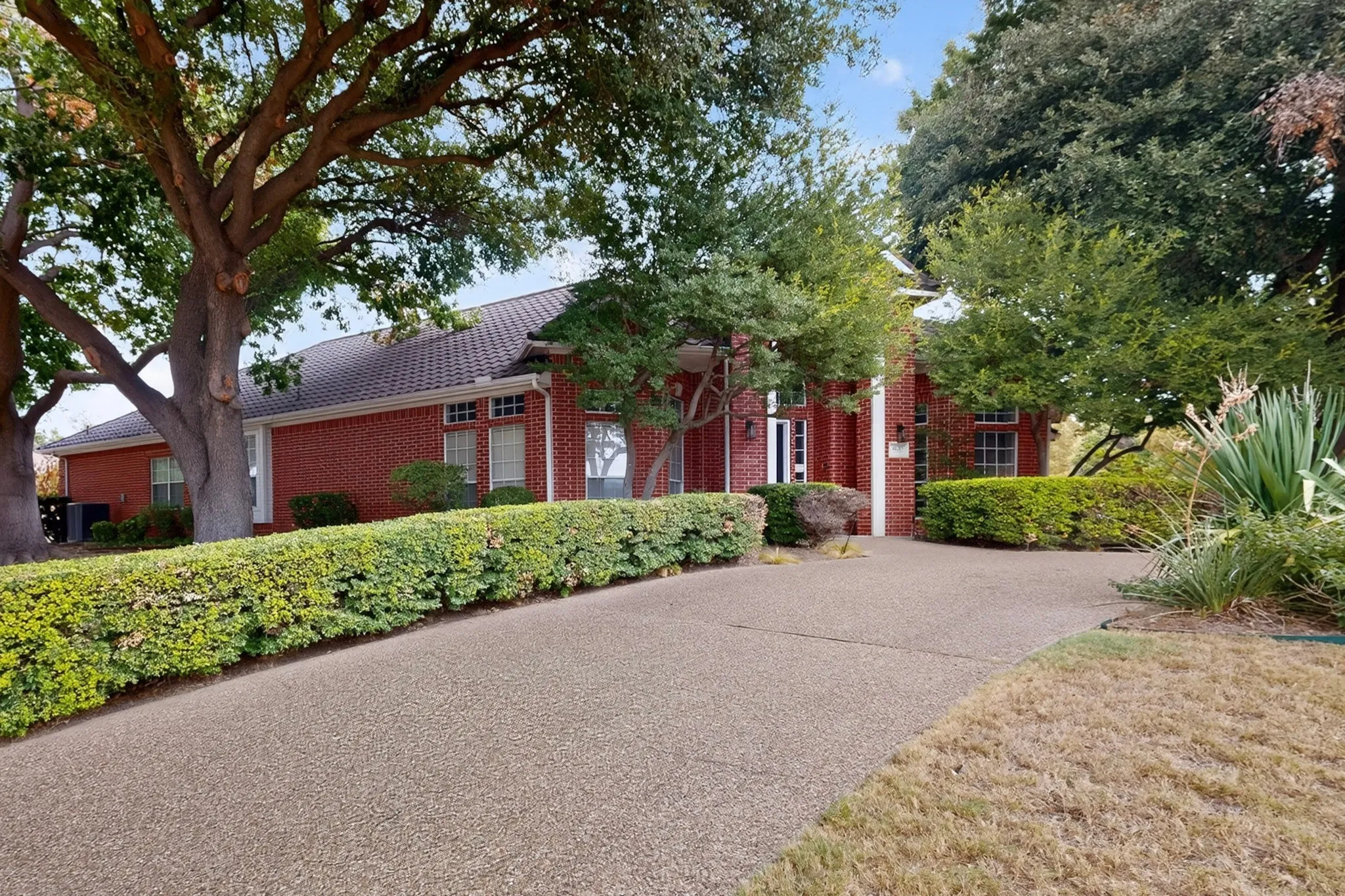 Brick exterior with a tiled roof