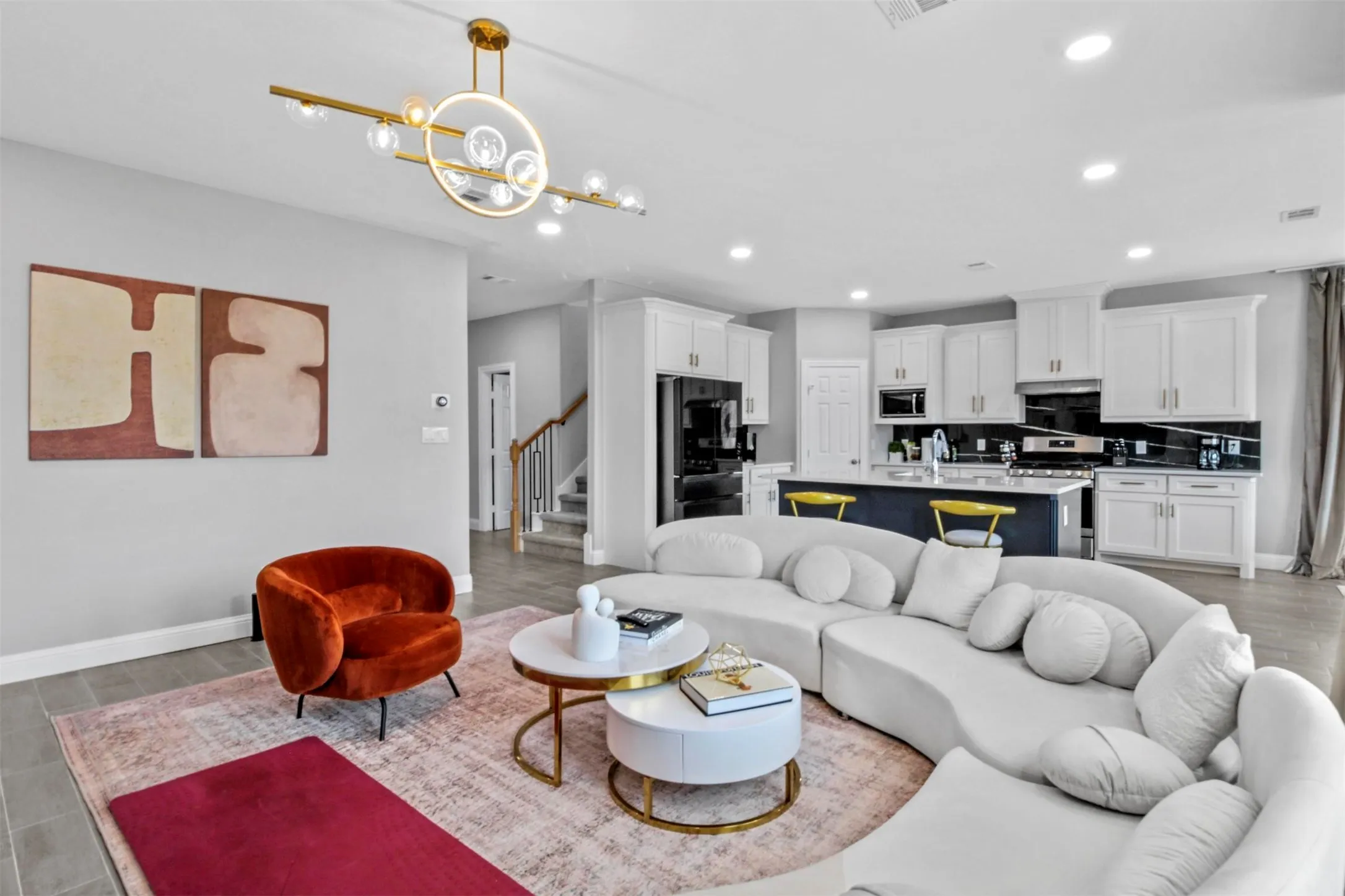 Open-concept living area featuring wood-finish flooring