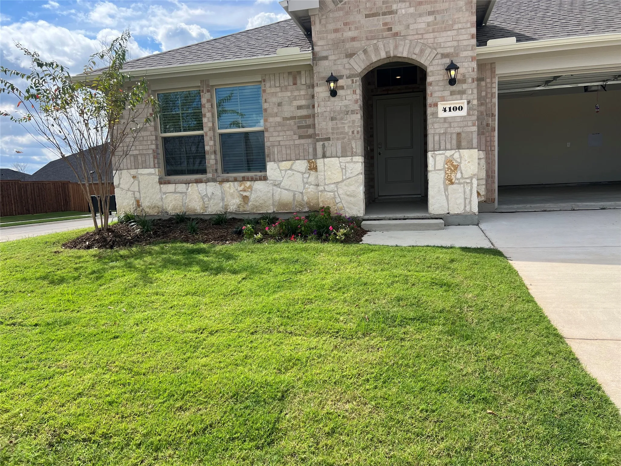 4100 Malachite ..exterior entry featuring brick and stone
