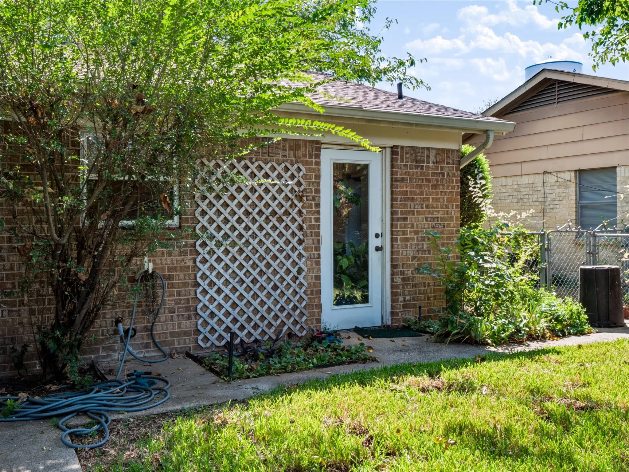 Brick exterior with white lattice detailing