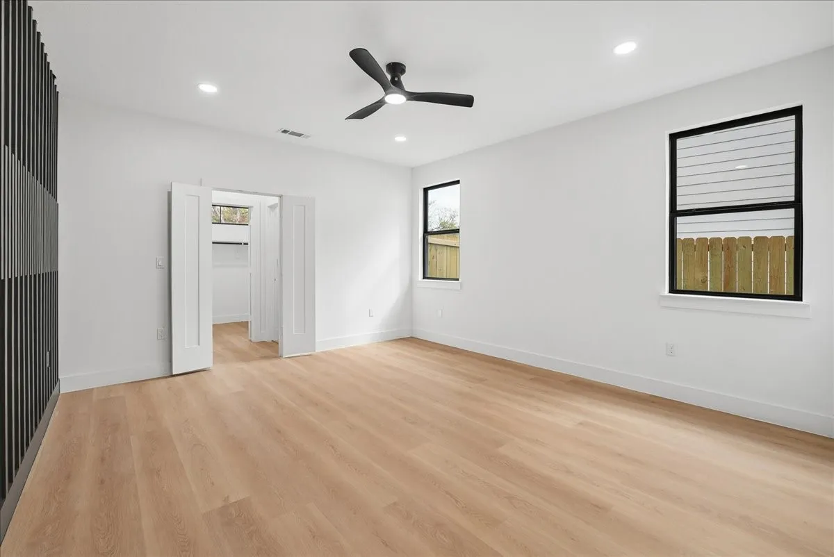Light wood-finish flooring, recessed lighting, and a ceiling fan