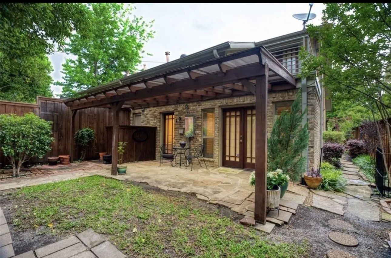 The back of the home has a beautiful covered patio with so much flexible styling. Also easy to maintain ground plants and cover. Yard maintenance is expected to be handled well by the Tenant.