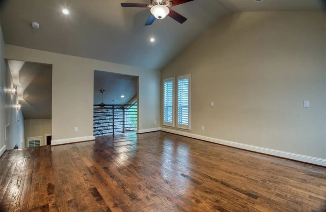 In addition to the second floor primary suite there is a first floor bedroom. This has a Juliette balcony overlooking the living area wonderful arched ceilings and a balcony. Hardwood floors throughout real hardwoods.