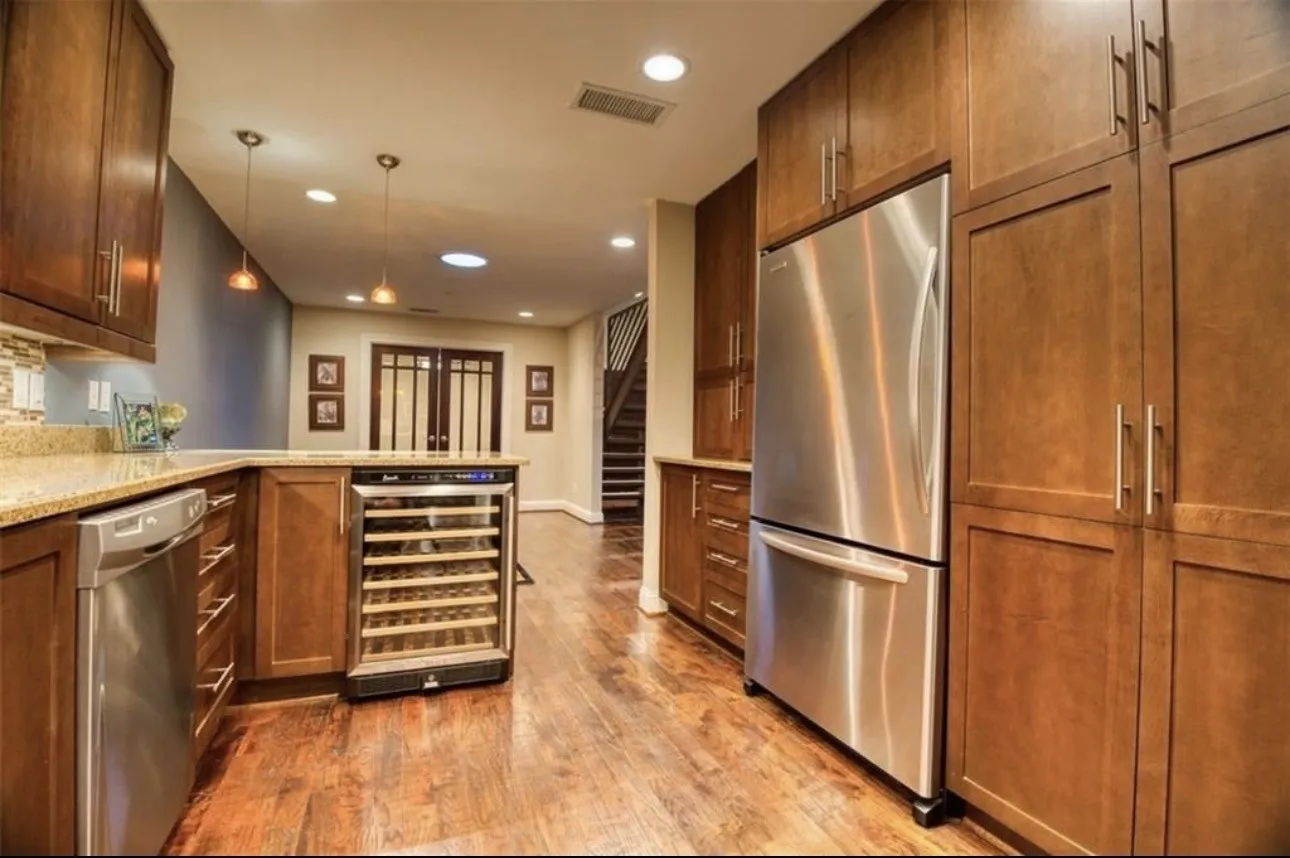 This photo emphasizes the stainless appliances which add a beautiful modern dimension.