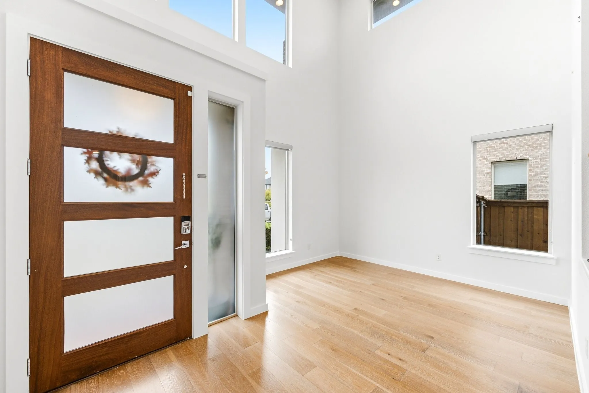 Grand foyer highlighted by architectural glass windows and abundant natural light.