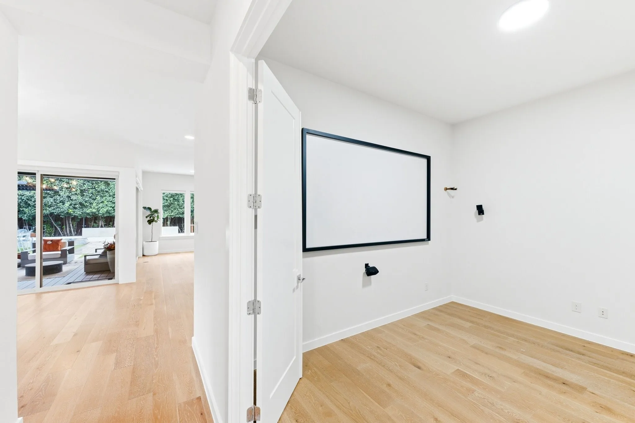 Dedicated downstairs media room designed for ultimate home cinematic entertainment