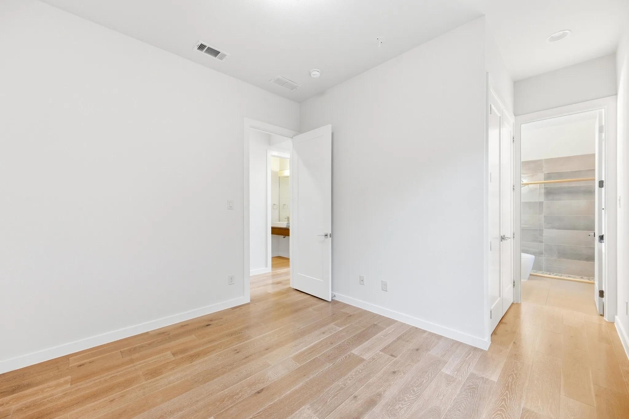 Private main-floor bedroom suite, ideal for multi-generational living or guests.