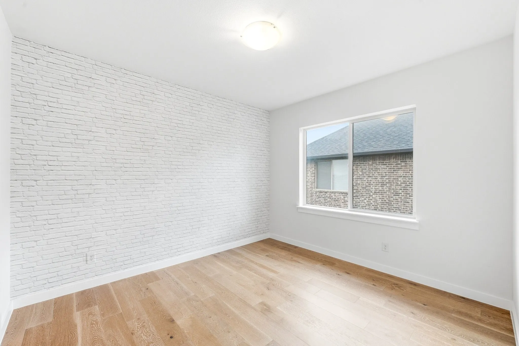 Spacious secondary bedroom positioned near the full remodeled bath for maximum convenience