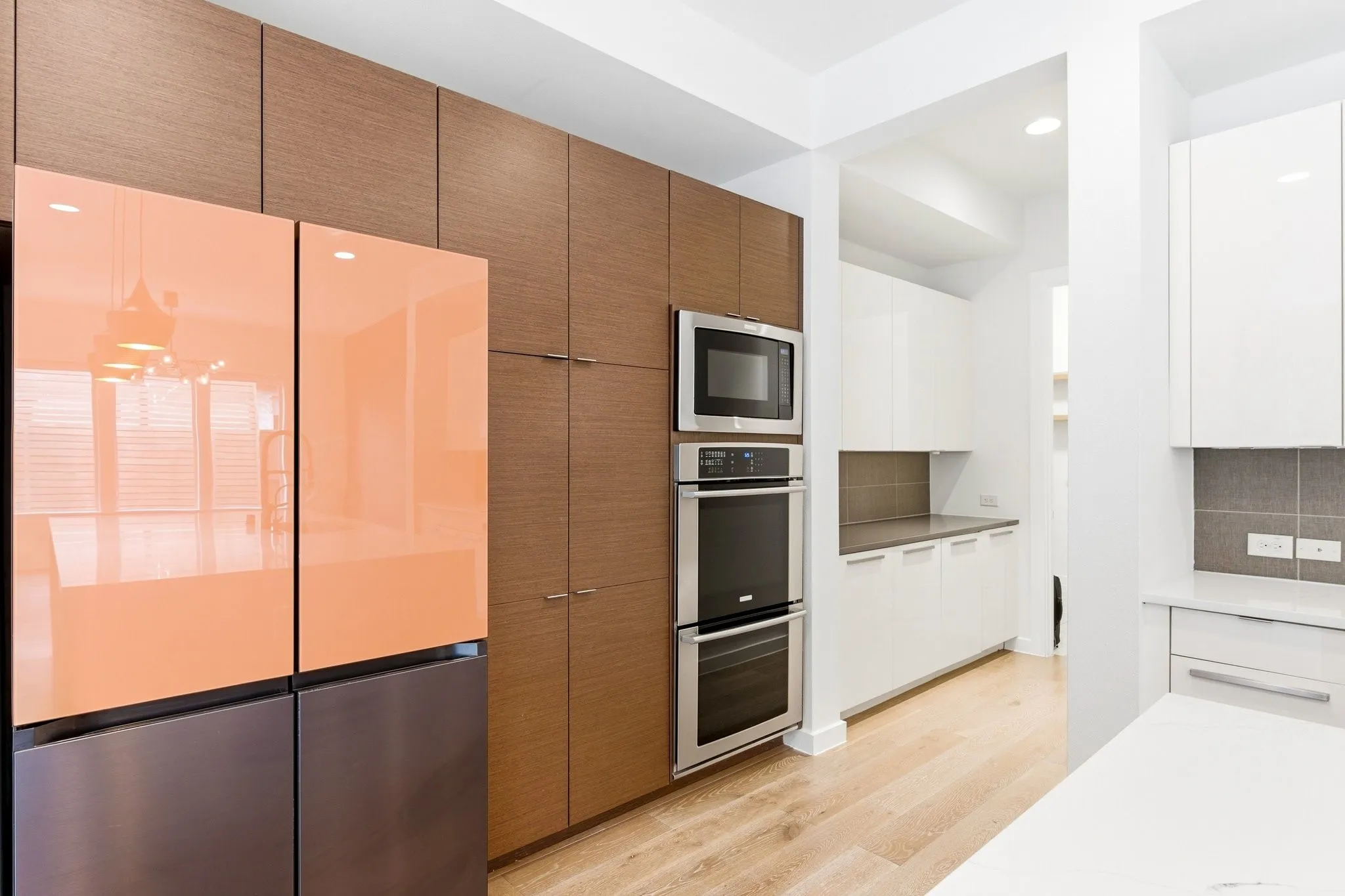 Built-in double ovens and integrated cabinetry providing exceptional kitchen storage.