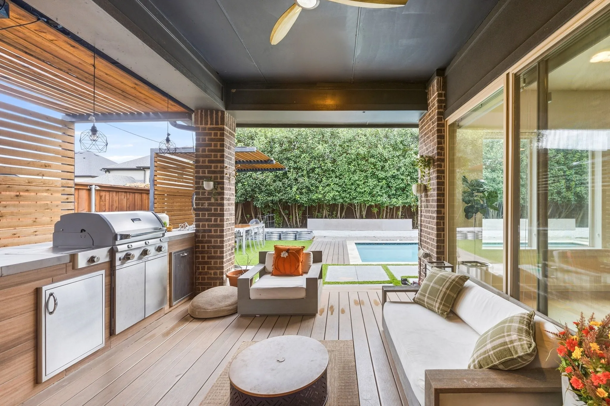 Covered entertaining patio complete with custom built-in outdoor kitchen and gas grill.