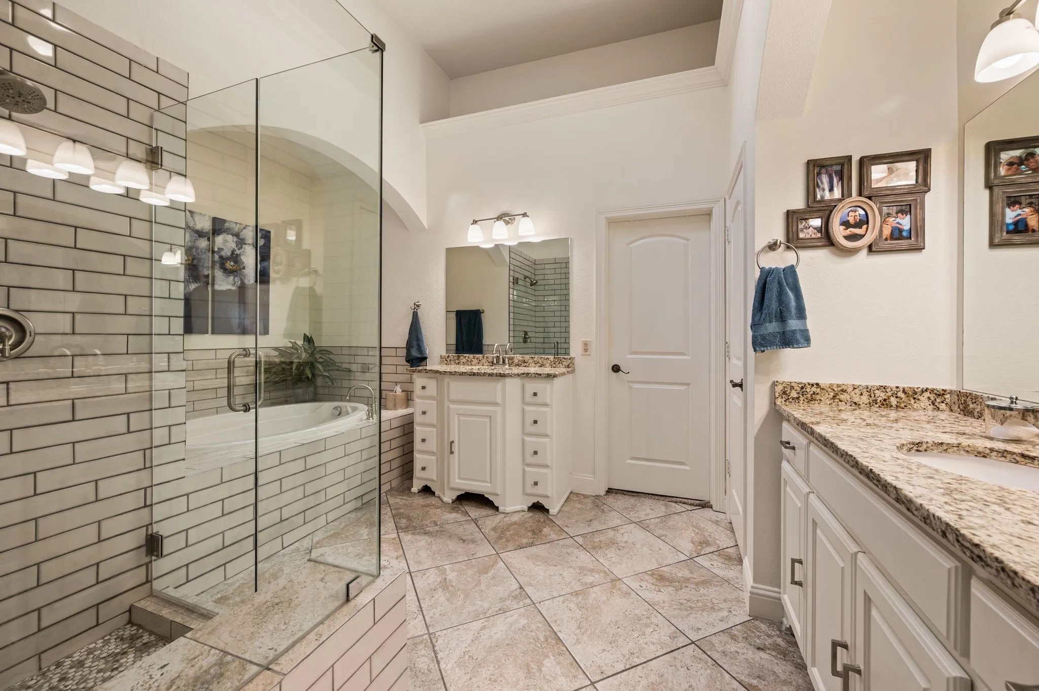 Pretty primary bath with split vanities