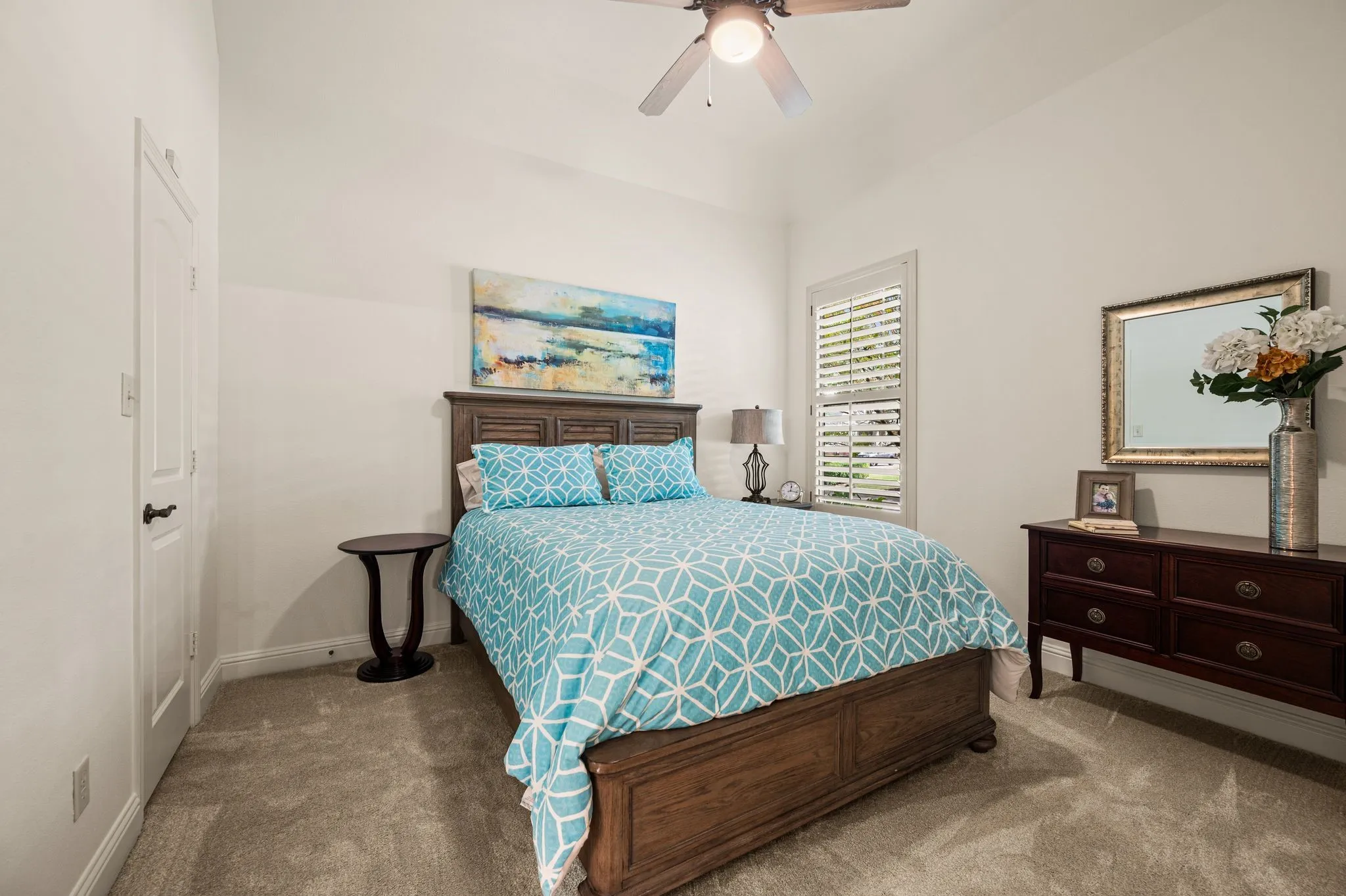 Secondary bedroom with access door to the guest bath