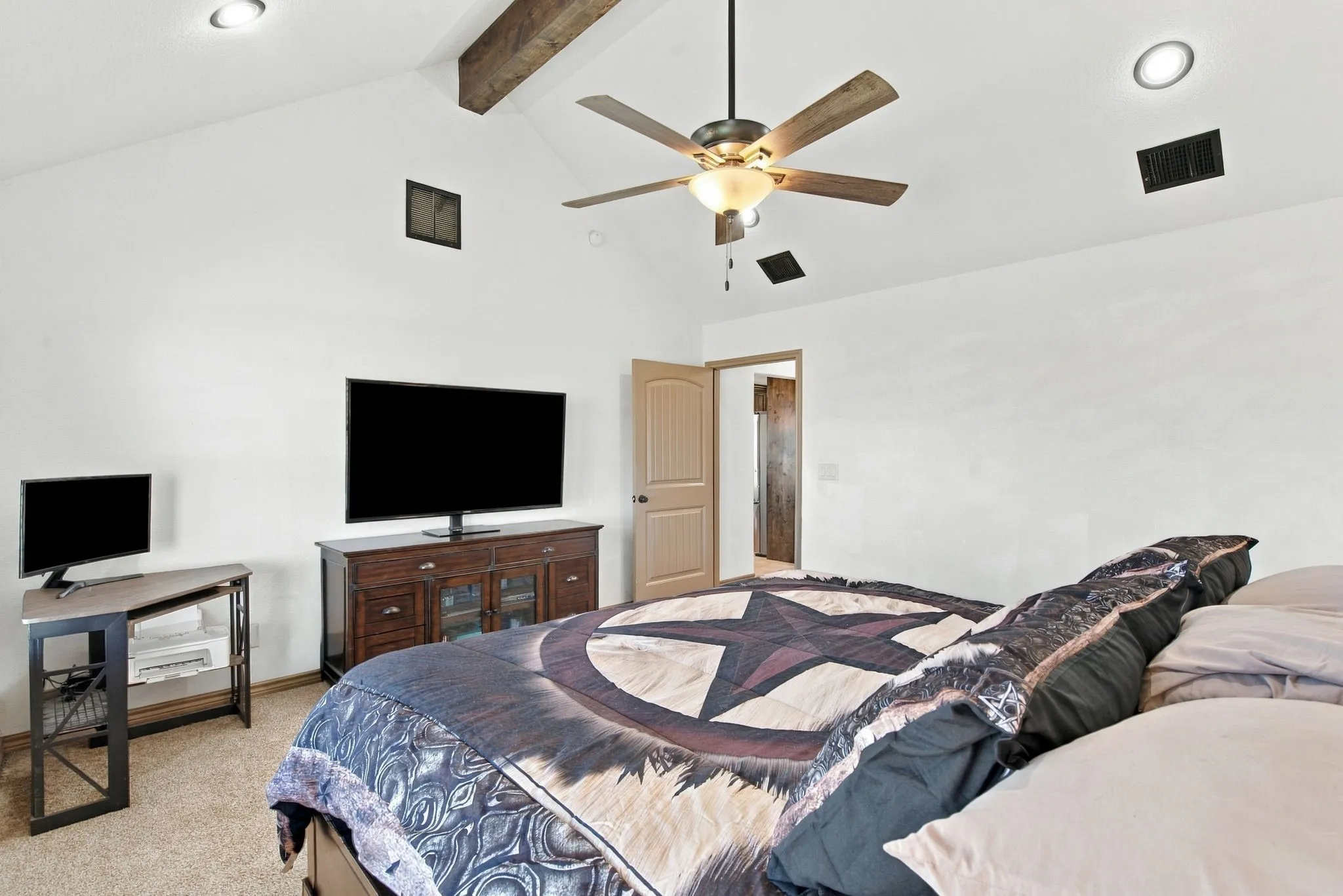 Vaulted ceiling with exposed wood beams, recessed lighting, and ceiling fan