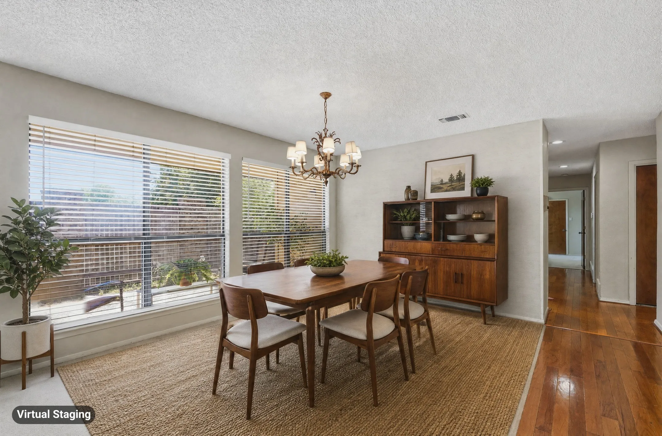 Recessed lighting, chandelier, multiple windows with blinds, and wood-finish flooring