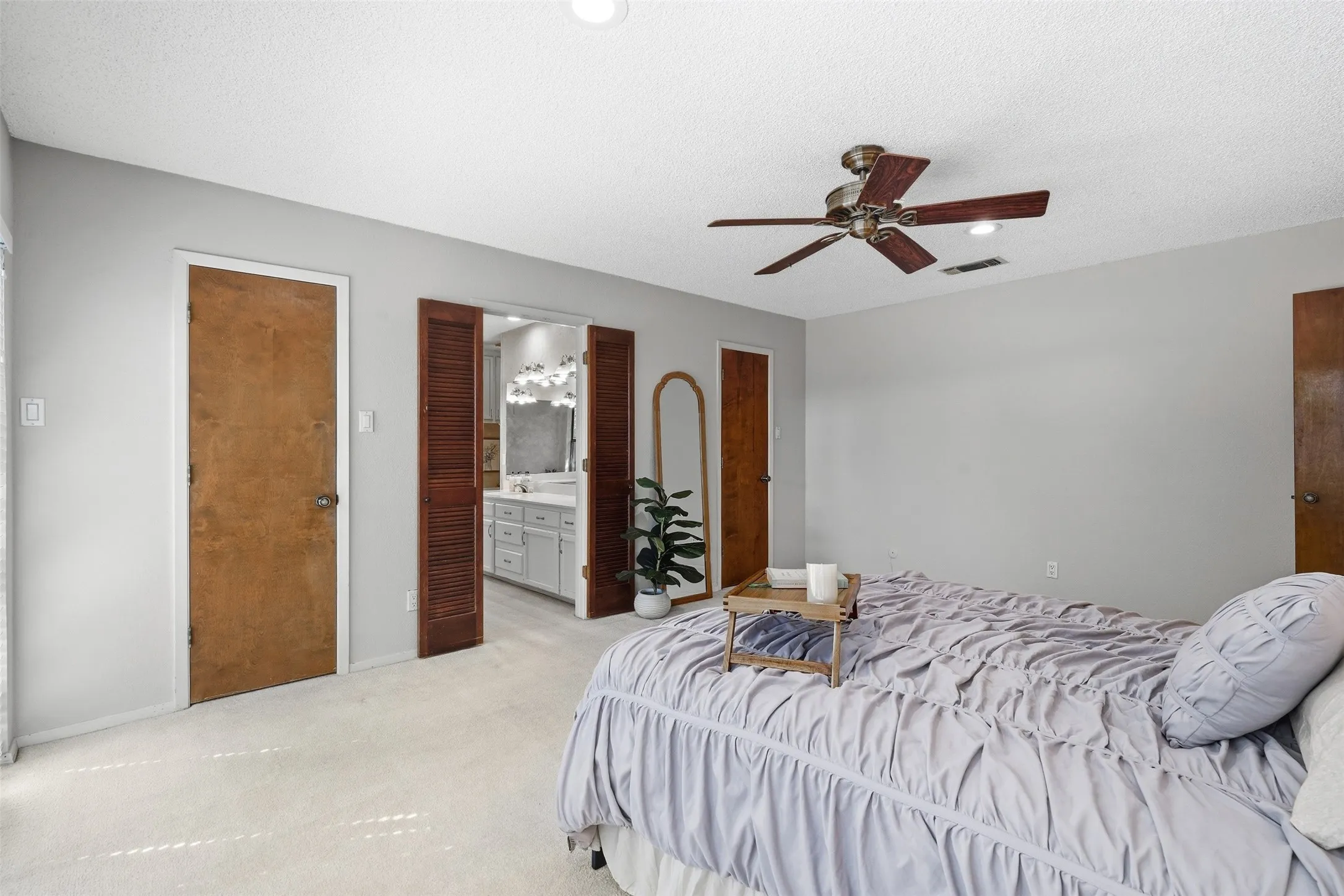 Carpeted flooring, recessed lighting, and a ceiling fan with integrated lighting